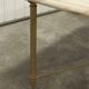 Marble coffee table with brass legs, height 46 cm.