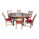 Round wooden table with 1 integrated extension + 6 wooden and fabric chairs