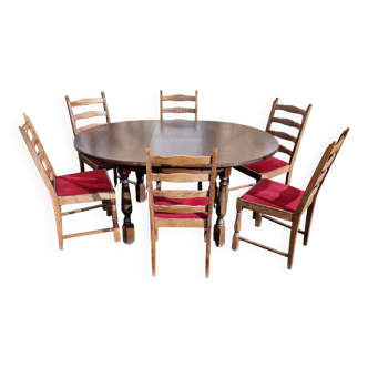 Round wooden table with 1 integrated extension + 6 wooden and fabric chairs