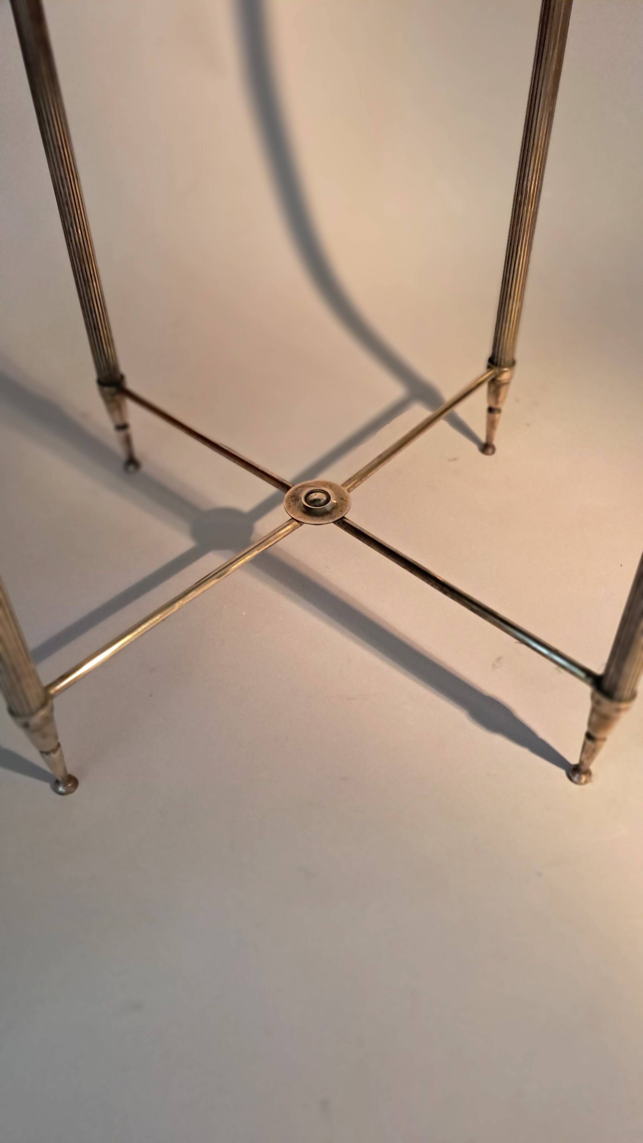 Gold brass side table in neoclassical style, circa 1960.