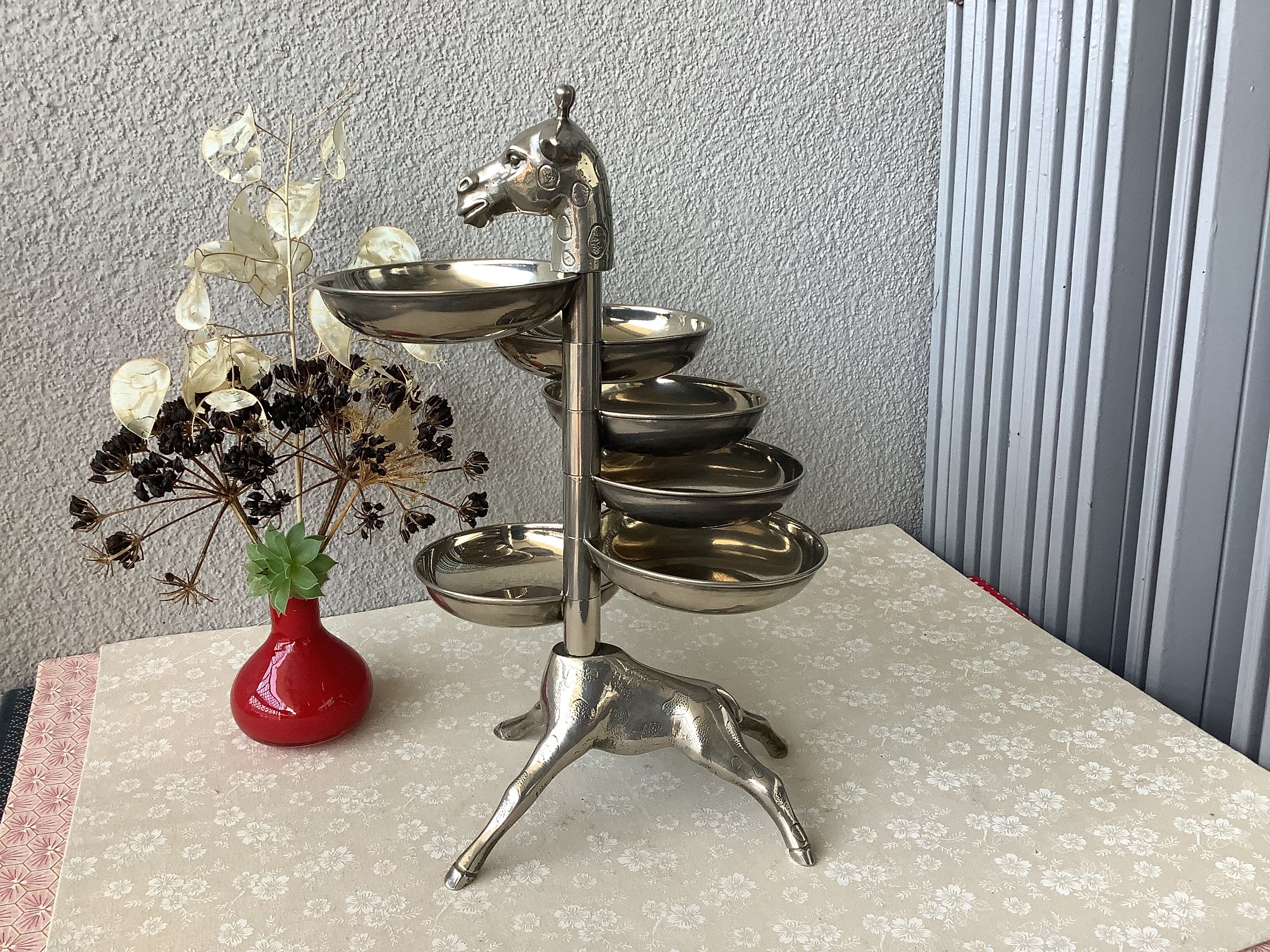 Bronze giraffe and silver metal servant