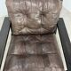 Living room sofa and brutalist armchairs in leather and wood, 70s, chalet style