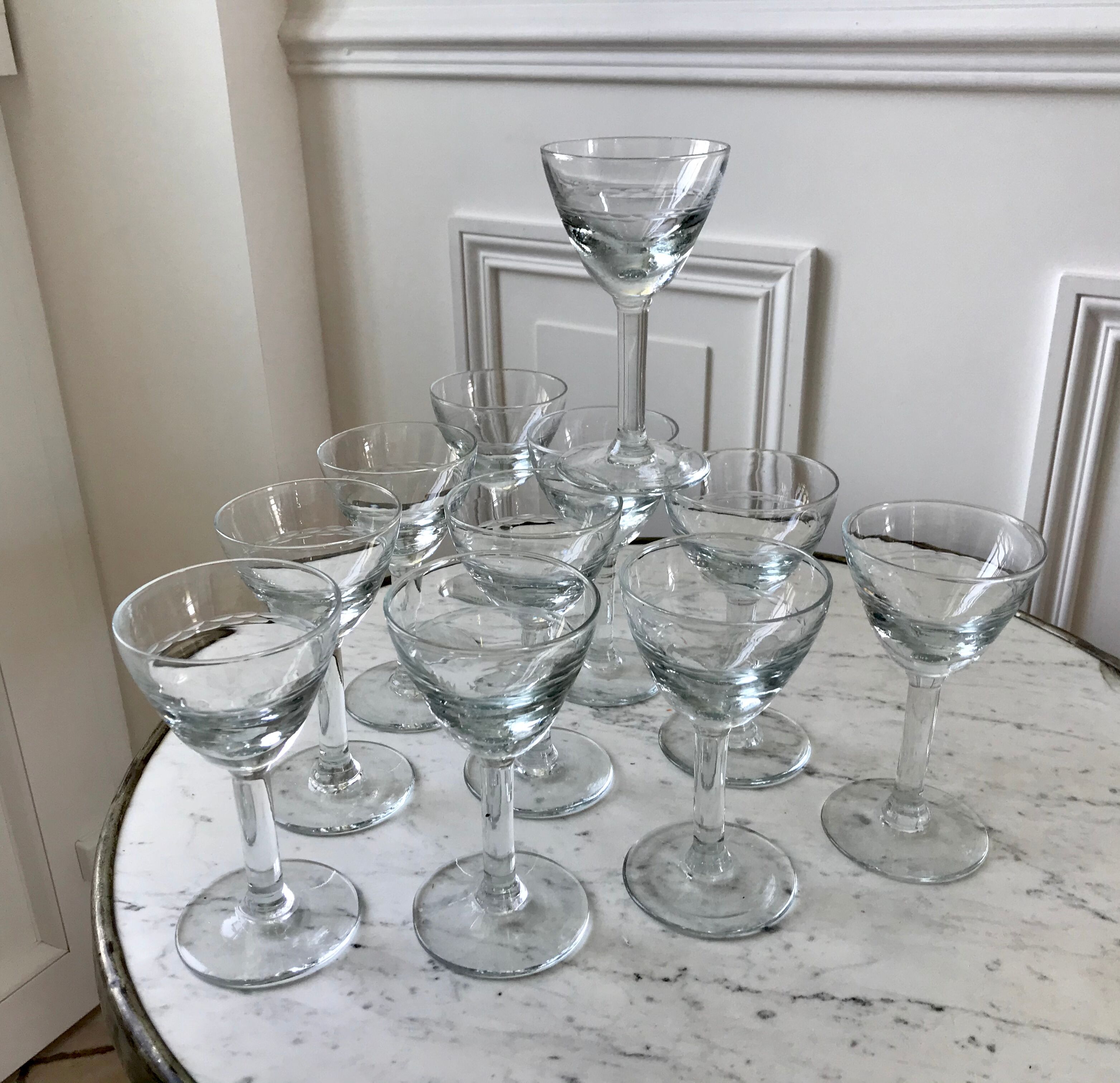 Set of 11 molded glass wine glasses engraved 20s