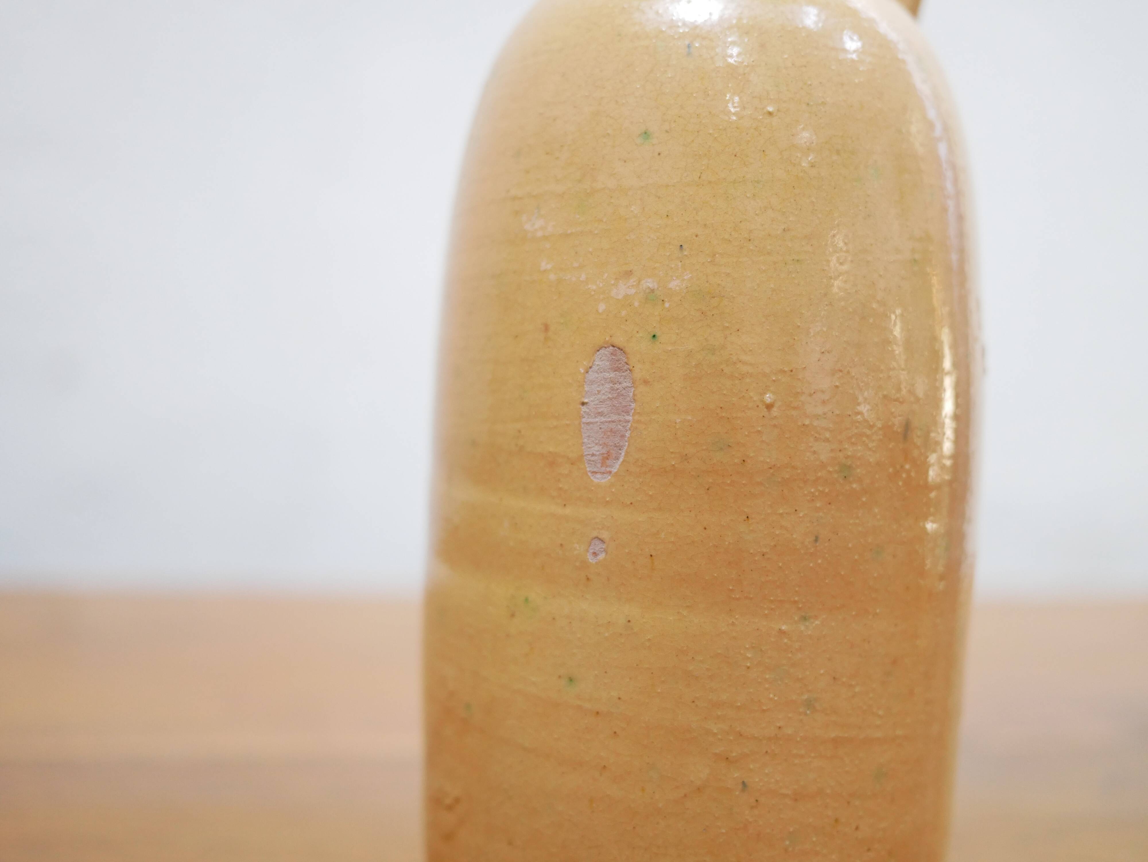 Vintage glazed terracotta bottle