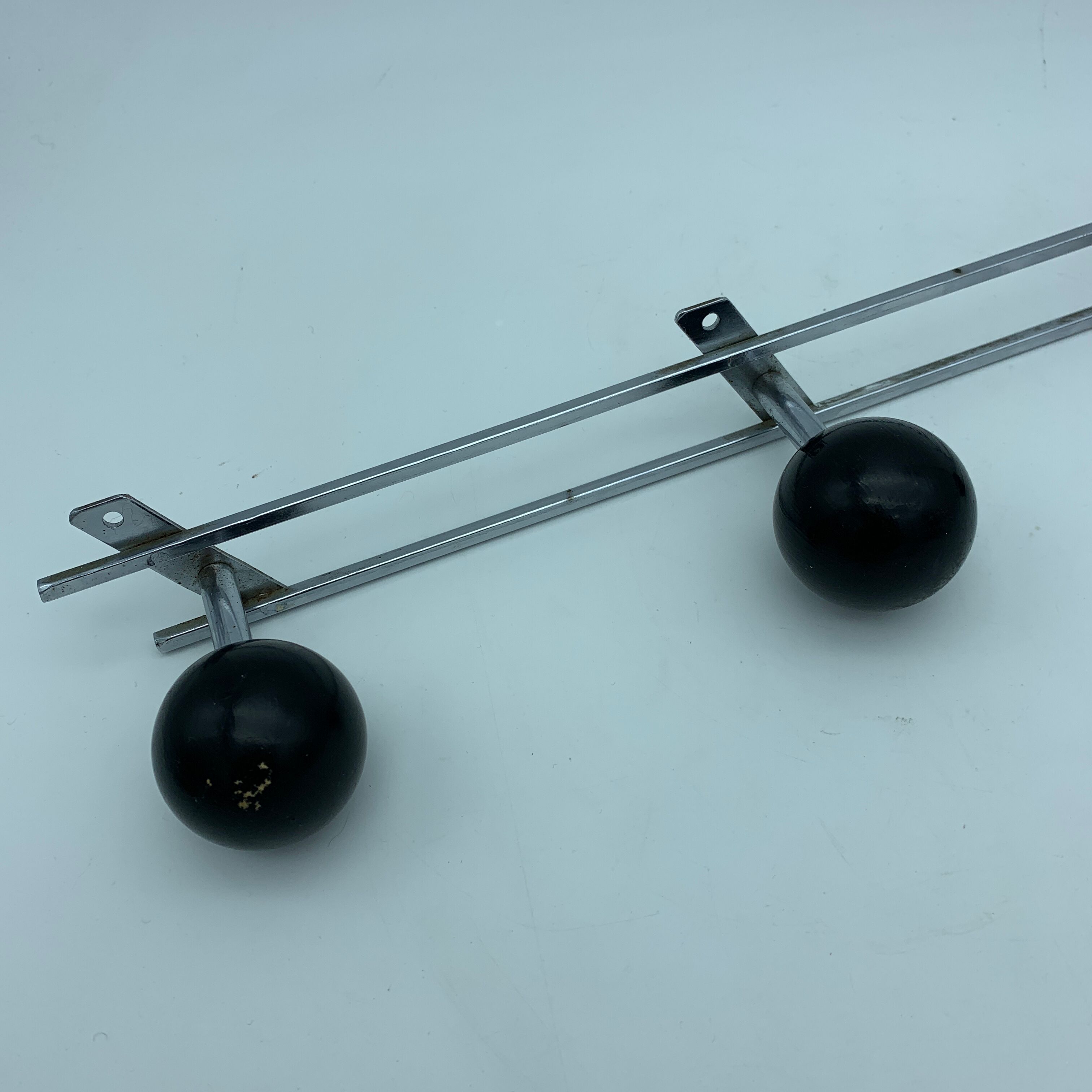 Coat holder 4 chrome steel pateres and black wooden balls