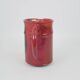 Red glazed ceramic jug with relief