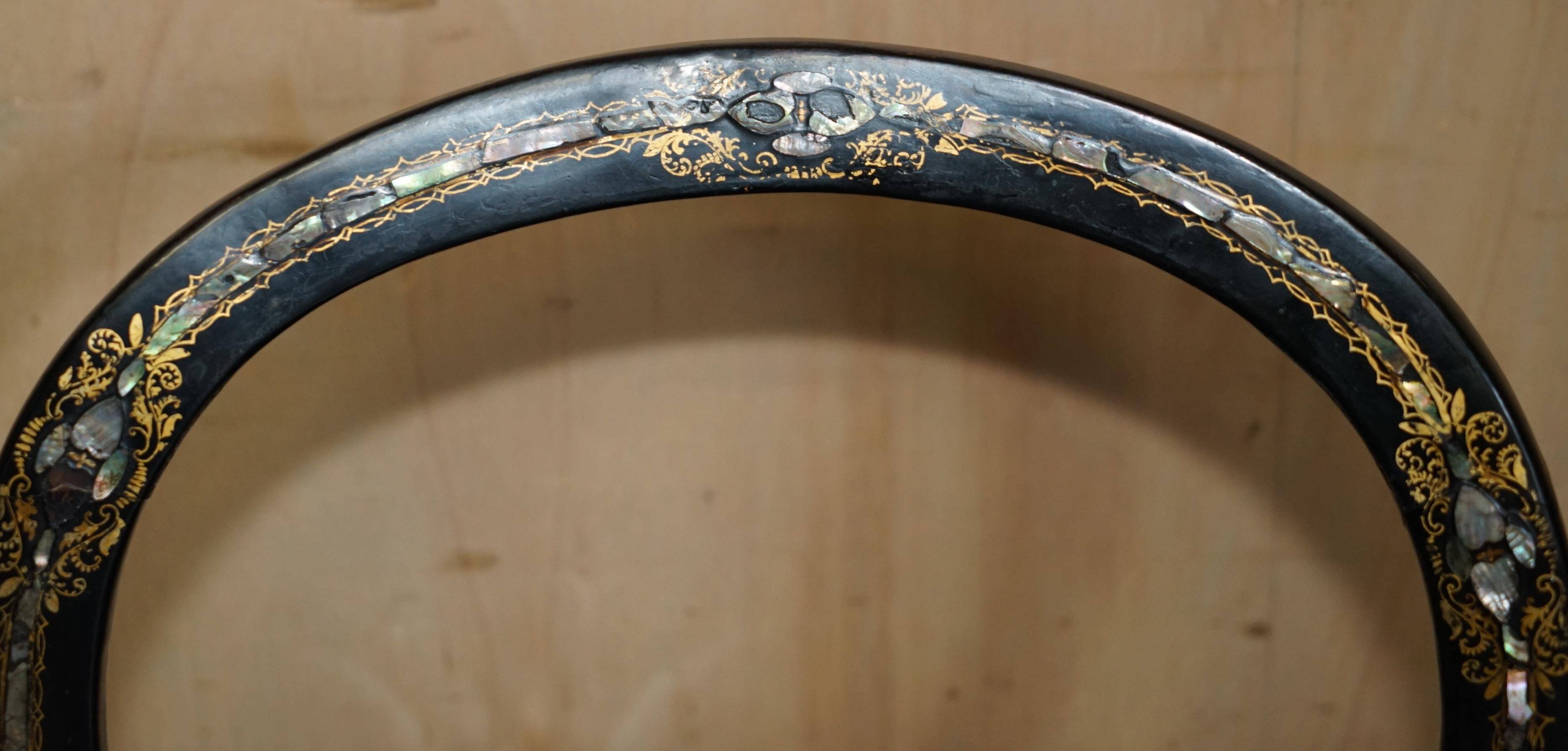 Four antique Regency bergère chairs with mother-of-pearl inlay.