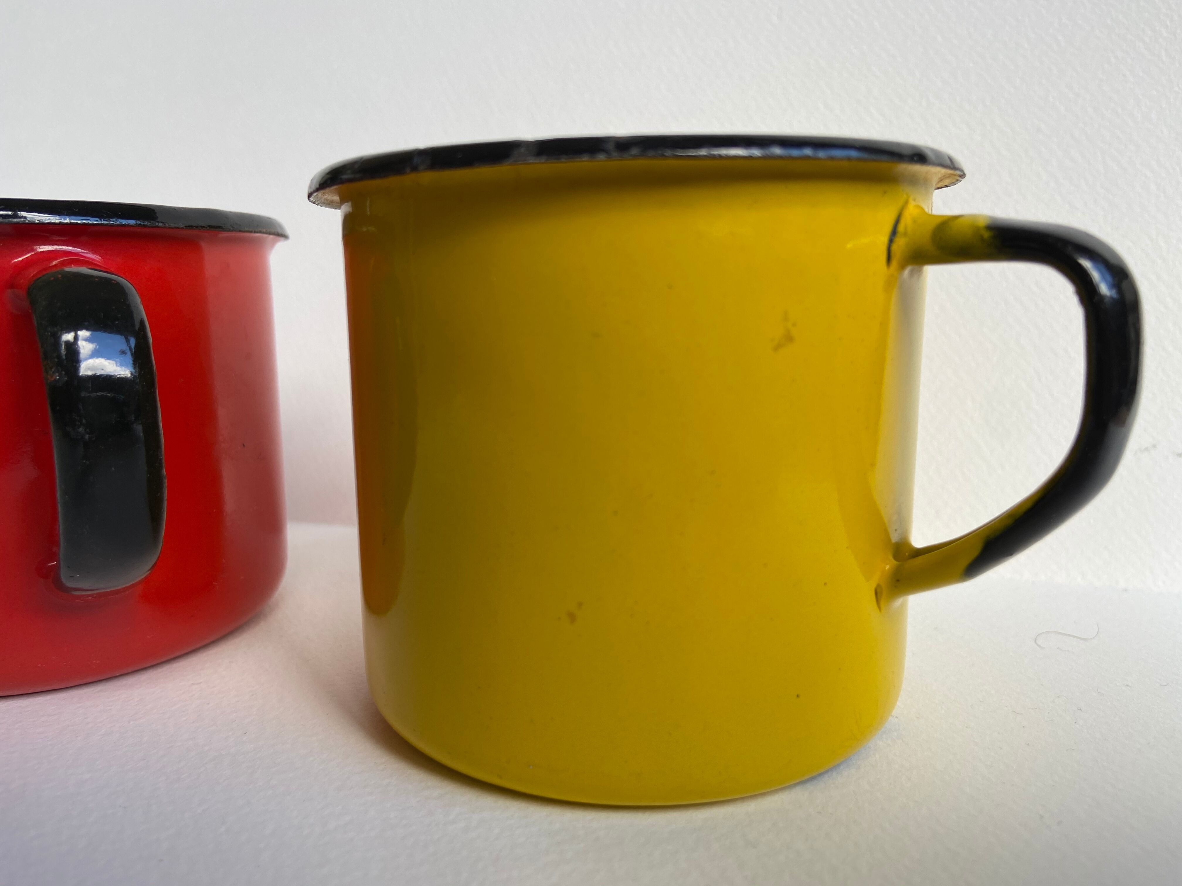 Pair of enamelled sheet metal mugs