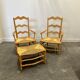 Pair of French Provencal Radassier beech chairs and ottoman, with rush seating.