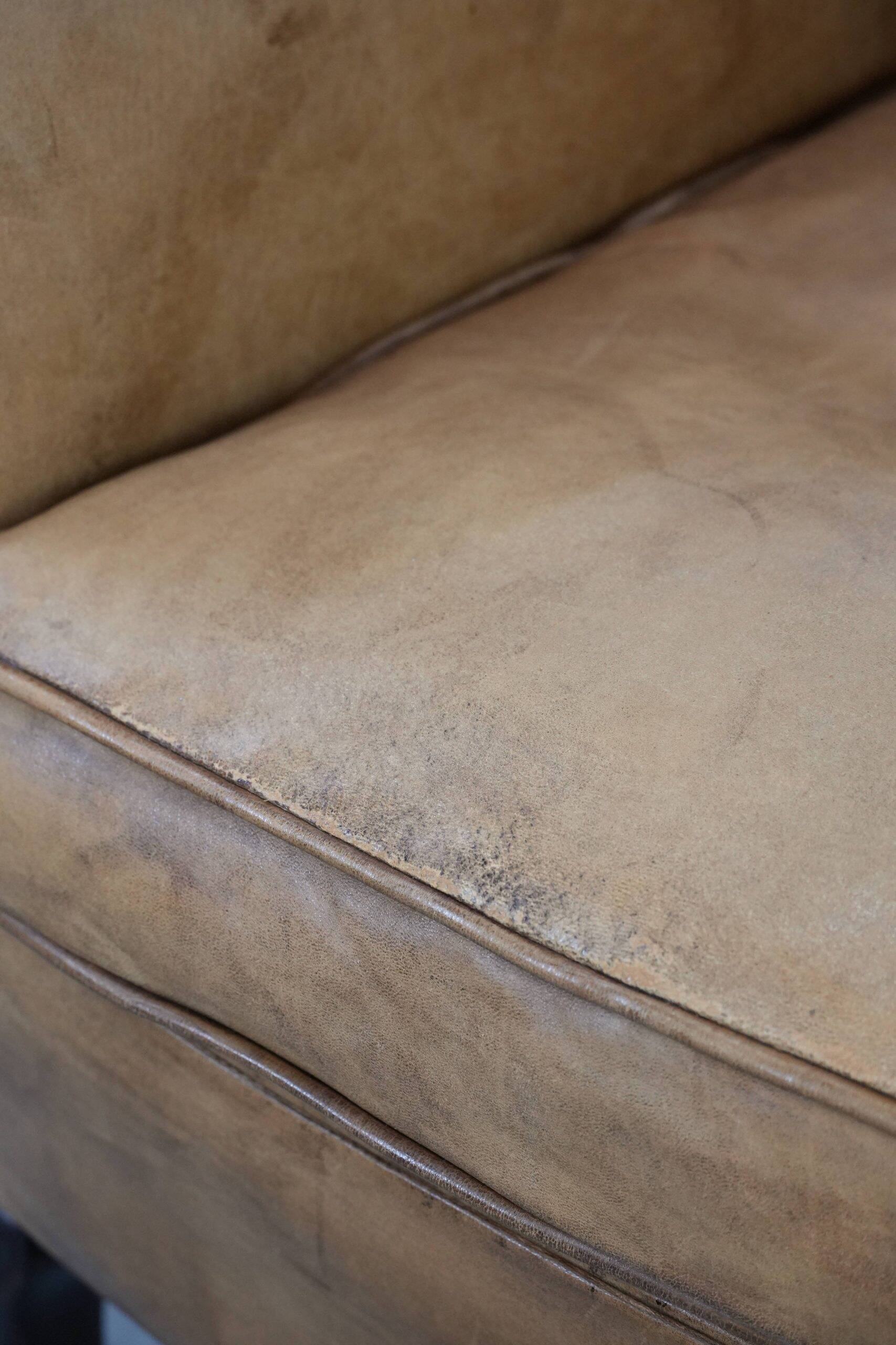 Beautiful subtle vintage sheepskin armchair with elegant legs
