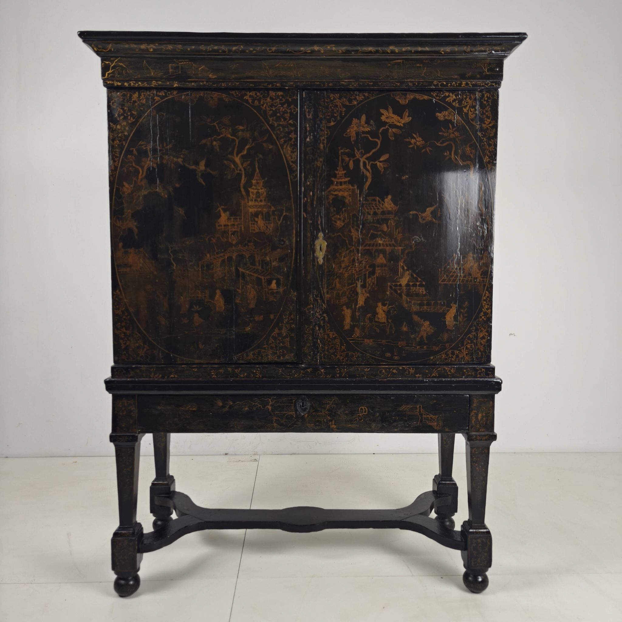 A rare early 18th-century Dutch japanned chinoiserie cabinet, circa 1700