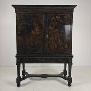 A rare early 18th-century Dutch japanned chinoiserie cabinet, circa 1700