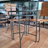 Glass and metal table and its 4 wicker chairs and glass Roche Bobois