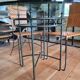 Glass and metal table and its 4 wicker chairs and glass Roche Bobois