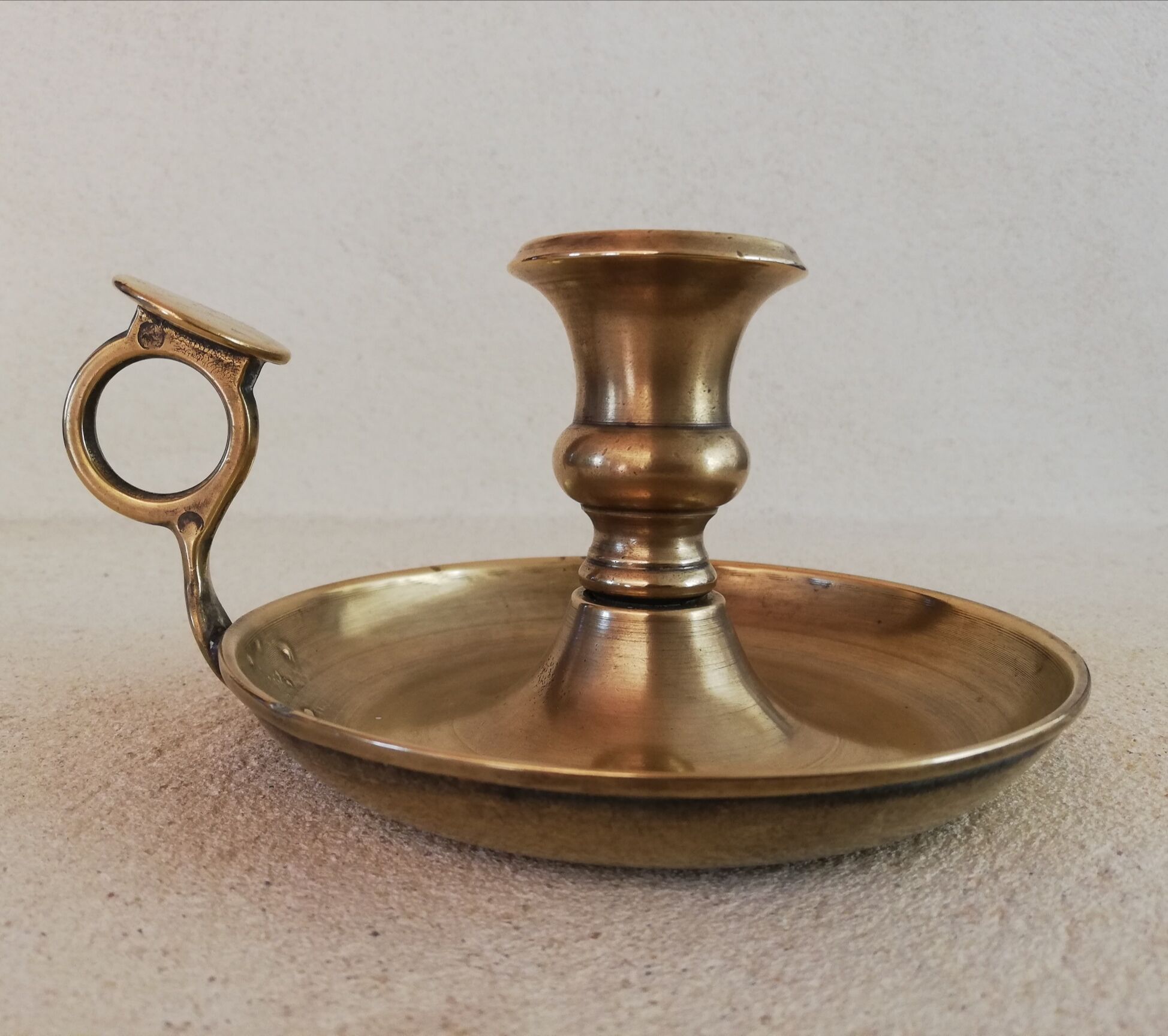 Brass hand candle holder
