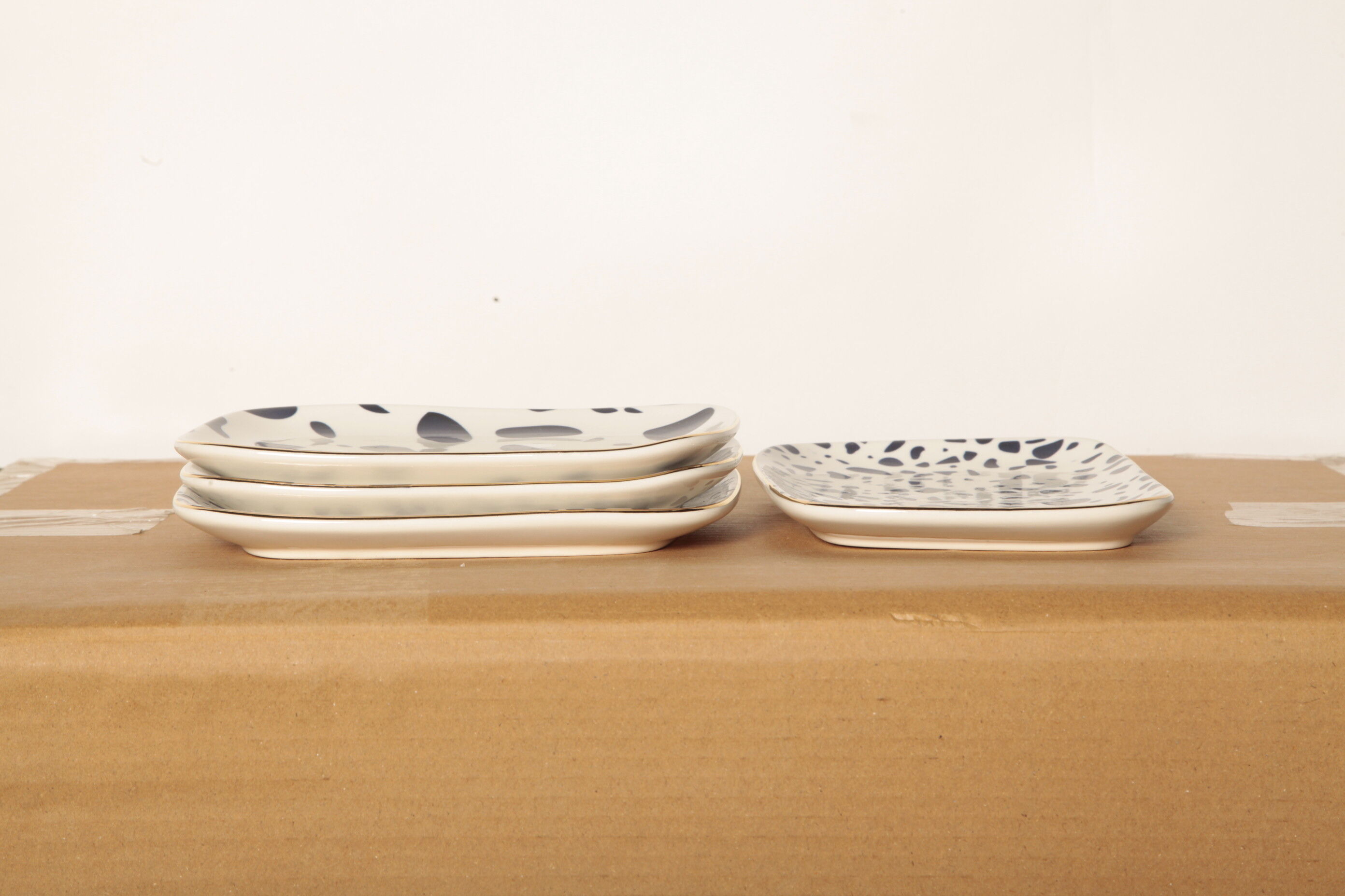 4 dishes blue terrazzo patterns