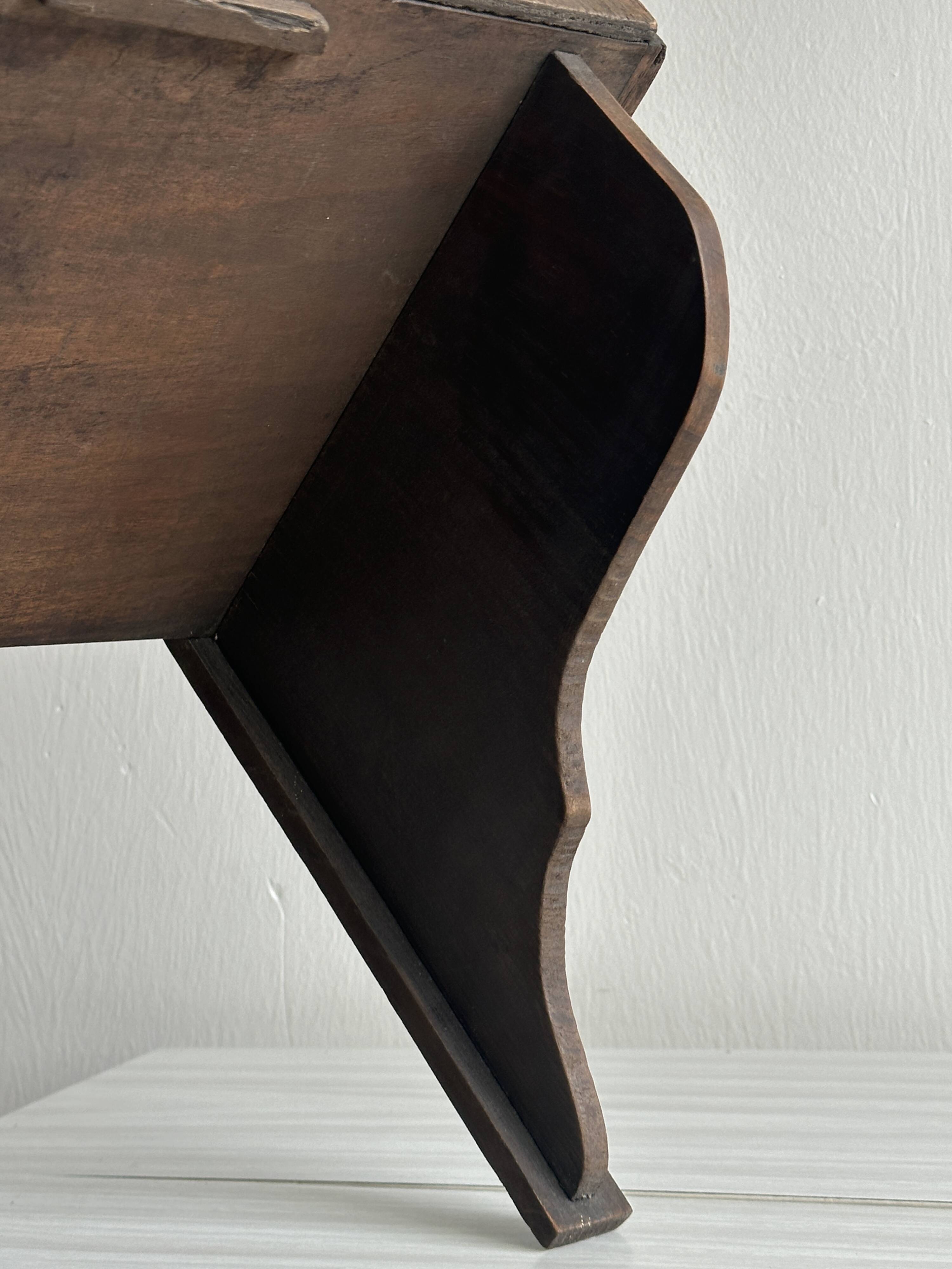 Antique wooden wall shelf.