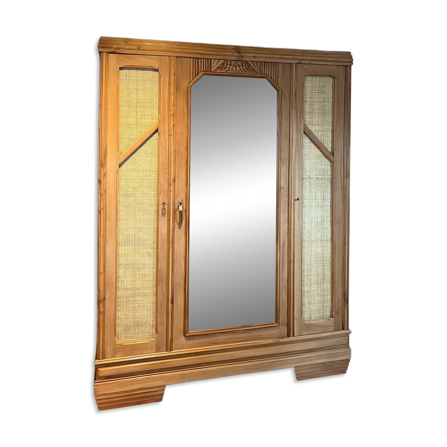 Large antique wardrobe made of solid raw wood and natural caning.