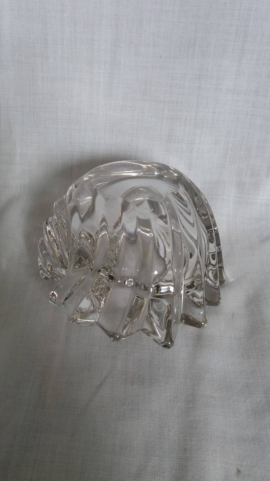 Shell-shaped crystal paperweight.