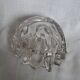 Shell-shaped crystal paperweight.