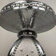 Small wooden pedestal table entirely covered with mirror mosaic