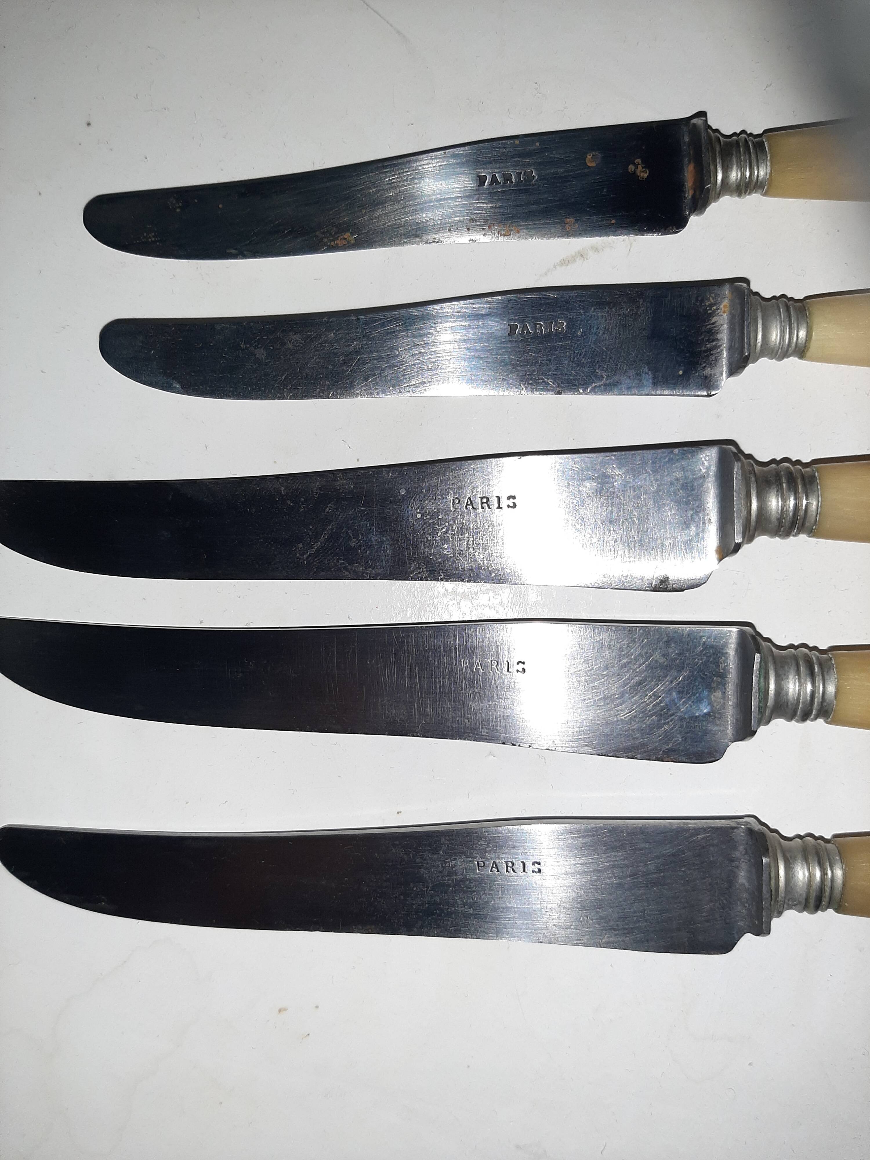 29-piece horn cutlery set, knives and serving utensils.