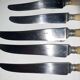 29-piece horn cutlery set, knives and serving utensils.