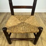 Pair of old wooden and straw children's chairs.