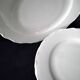 4 white Limoges porcelain dessert plates