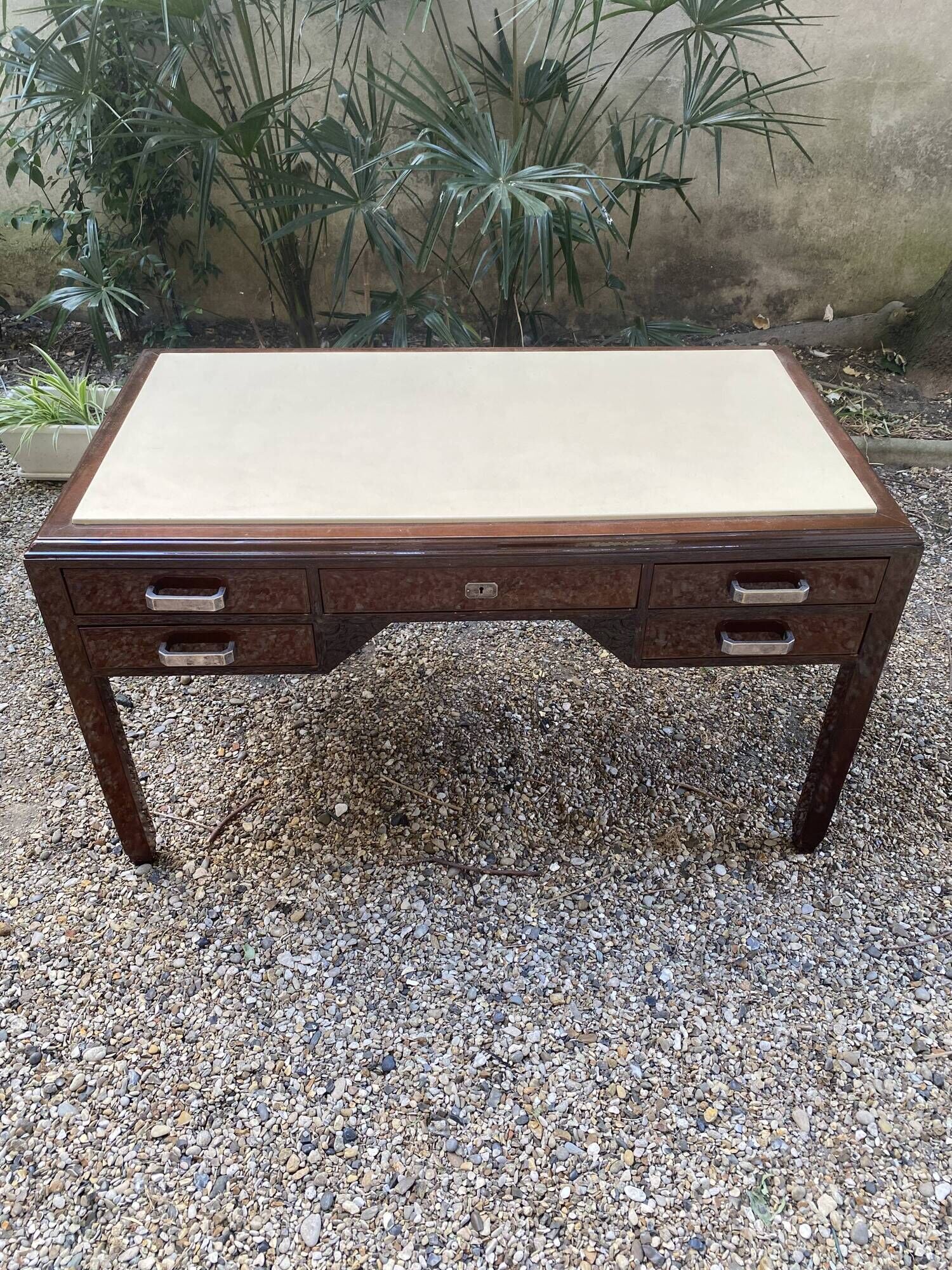 Art Deco desk in varnished mahogany.