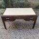 Art Deco desk in varnished mahogany.