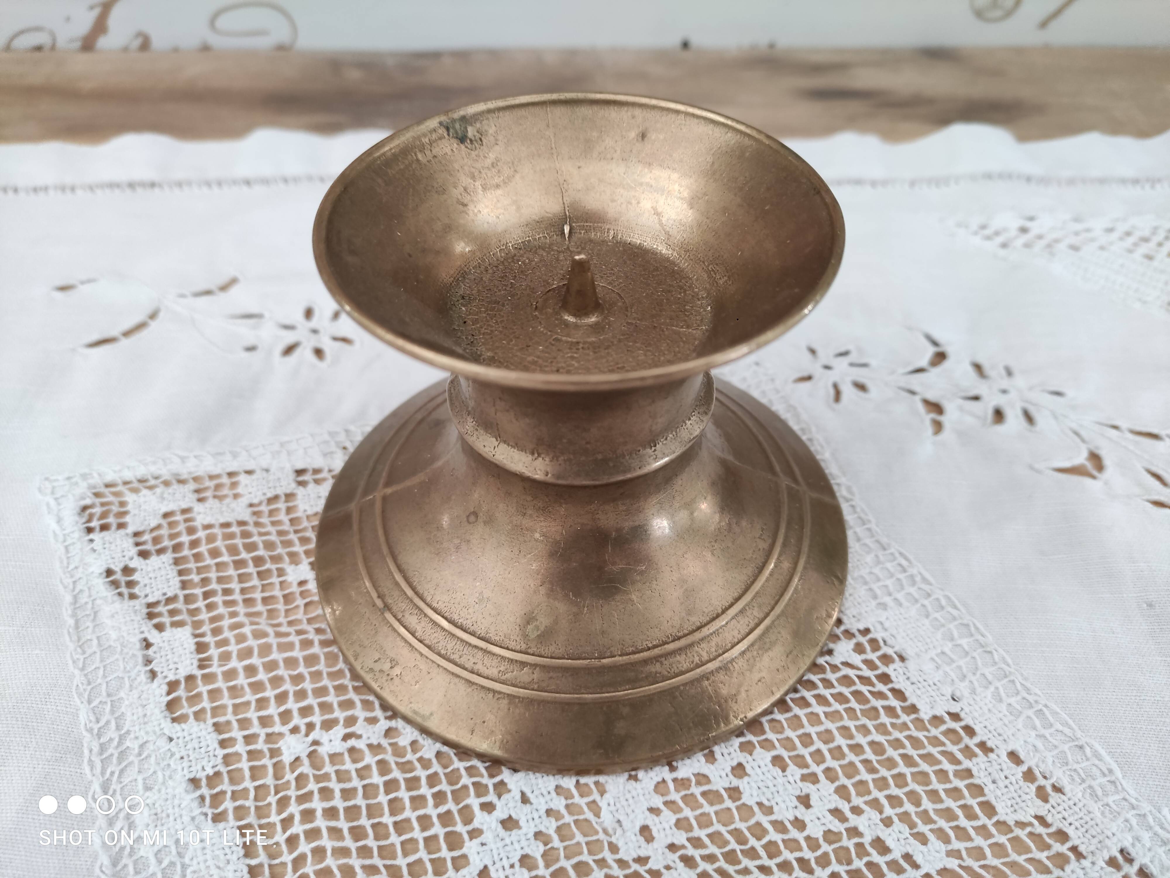 Low brass candle holder
