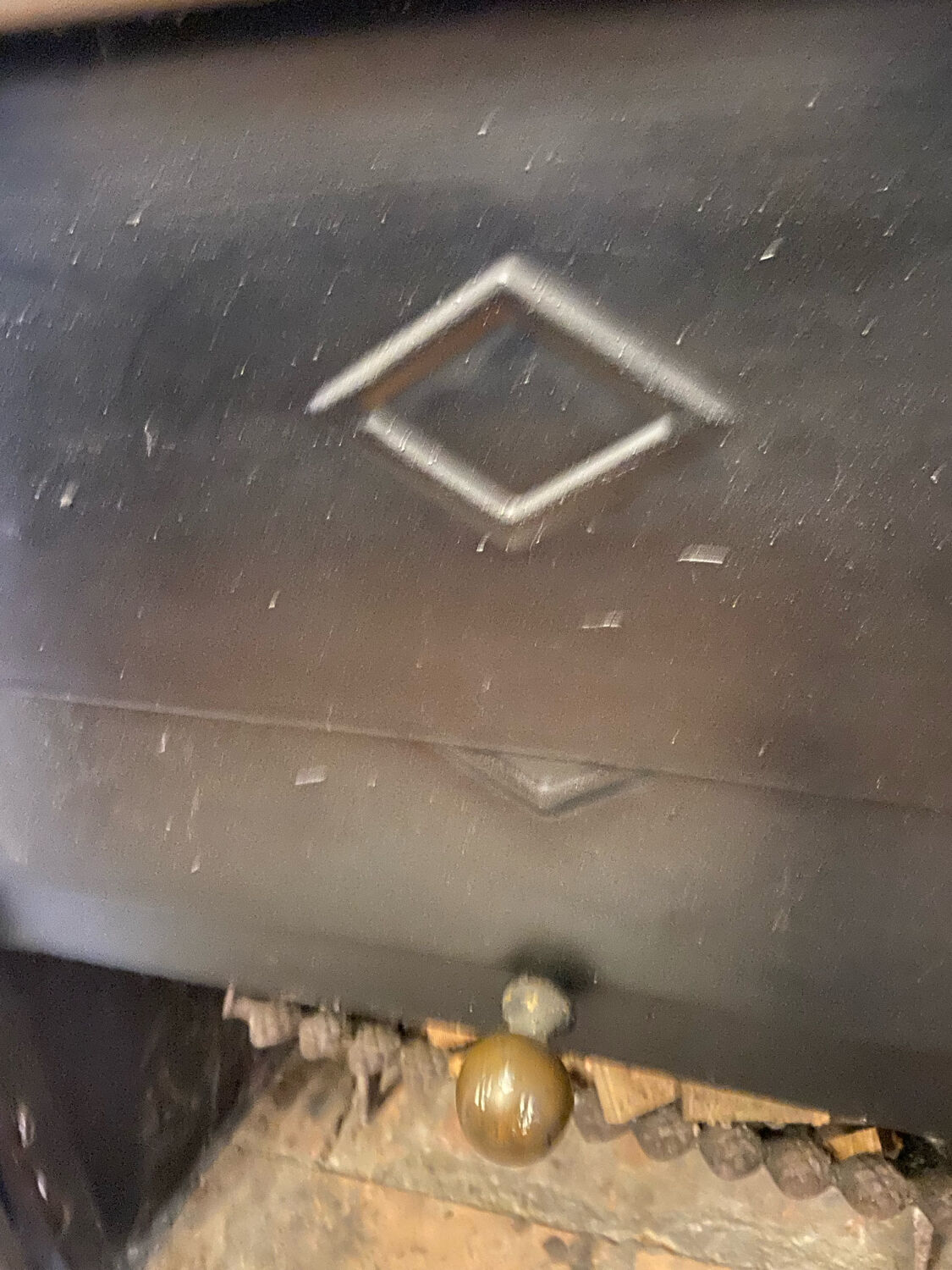 Marble fireplace surround with closed hearth frame.