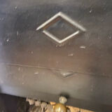 Marble fireplace surround with closed hearth frame.