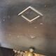 Marble fireplace surround with closed hearth frame.
