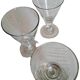 Three conical measuring glasses
