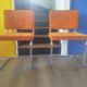 Pair of vintage cantilever chairs in chrome and orange corduroy.