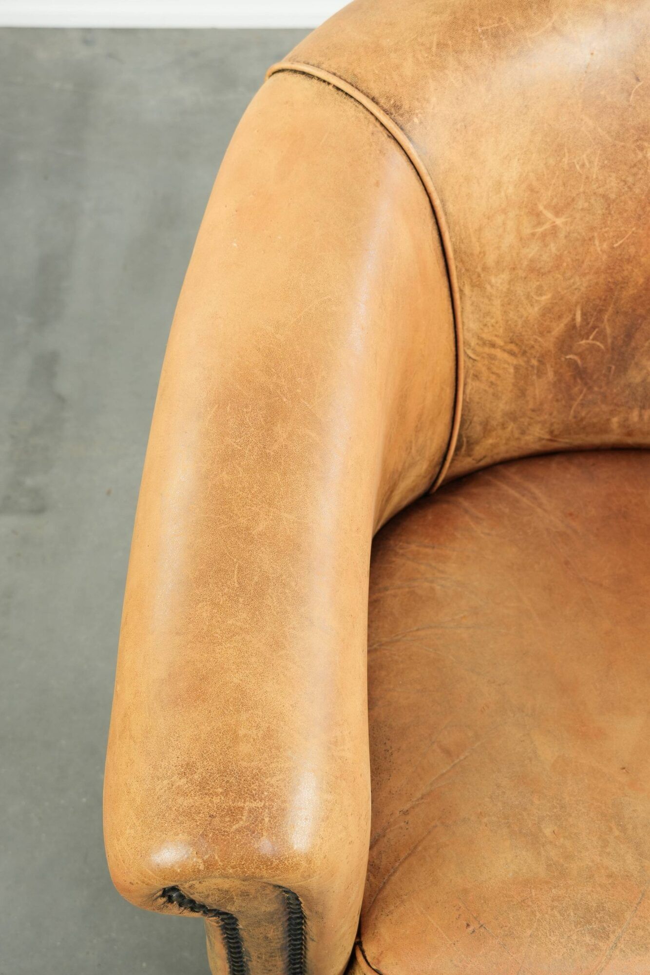 Vintage sheepskin club armchair in a light cognac colour