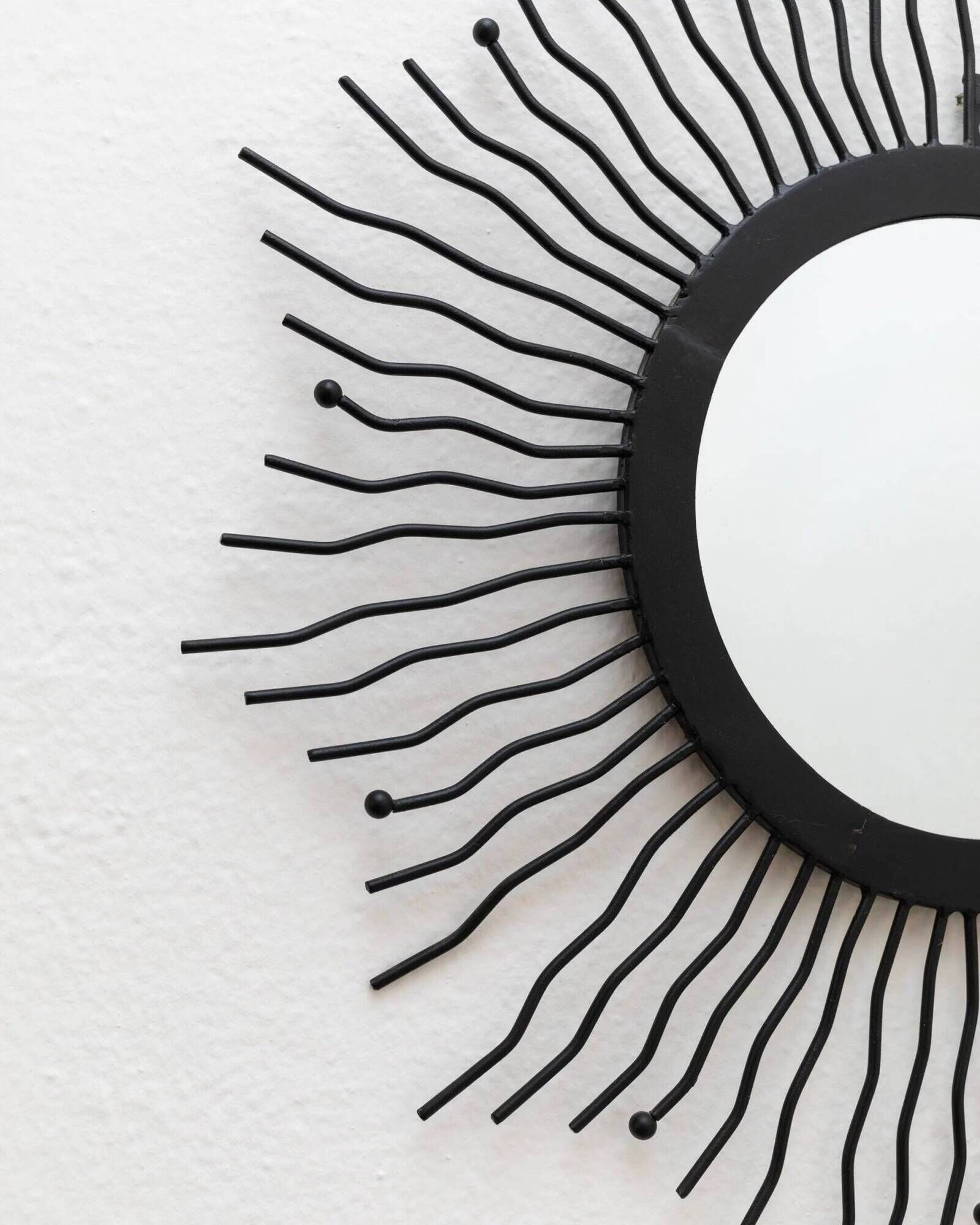 Black metal sunburst wall mirror, round 63x63 cm, vintage 1990s, made in Italy