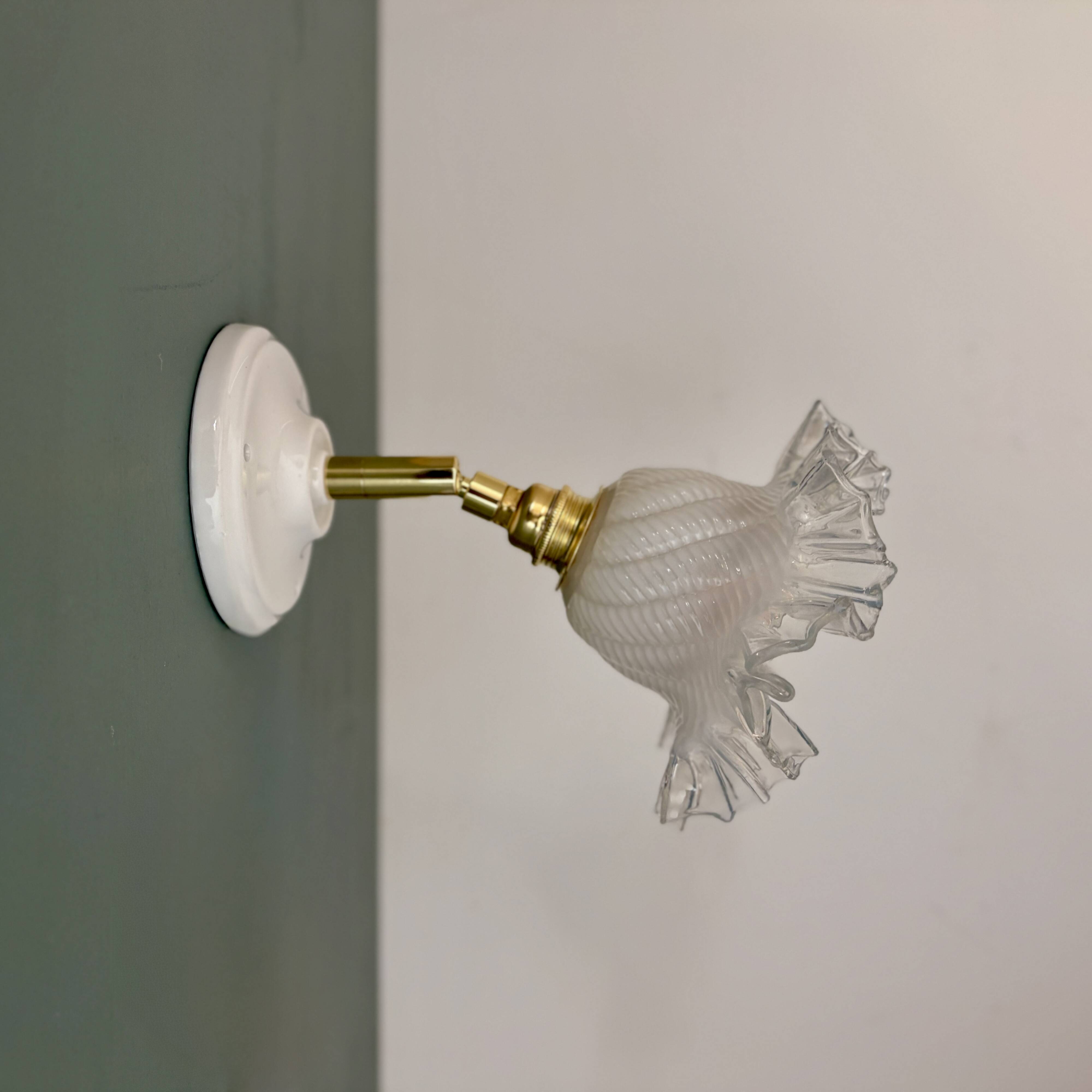 Vintage tulip glass wall light in transparent, slightly pearlescent white.