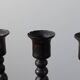 Candelabrum in the shape of a spool, skilfully forged in menorah style.