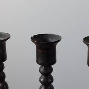Candelabrum in the shape of a spool, skilfully forged in menorah style.
