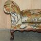 Antique banquette with cluster and ball feet, window seat in Mulberry Flying Ducks fabric.