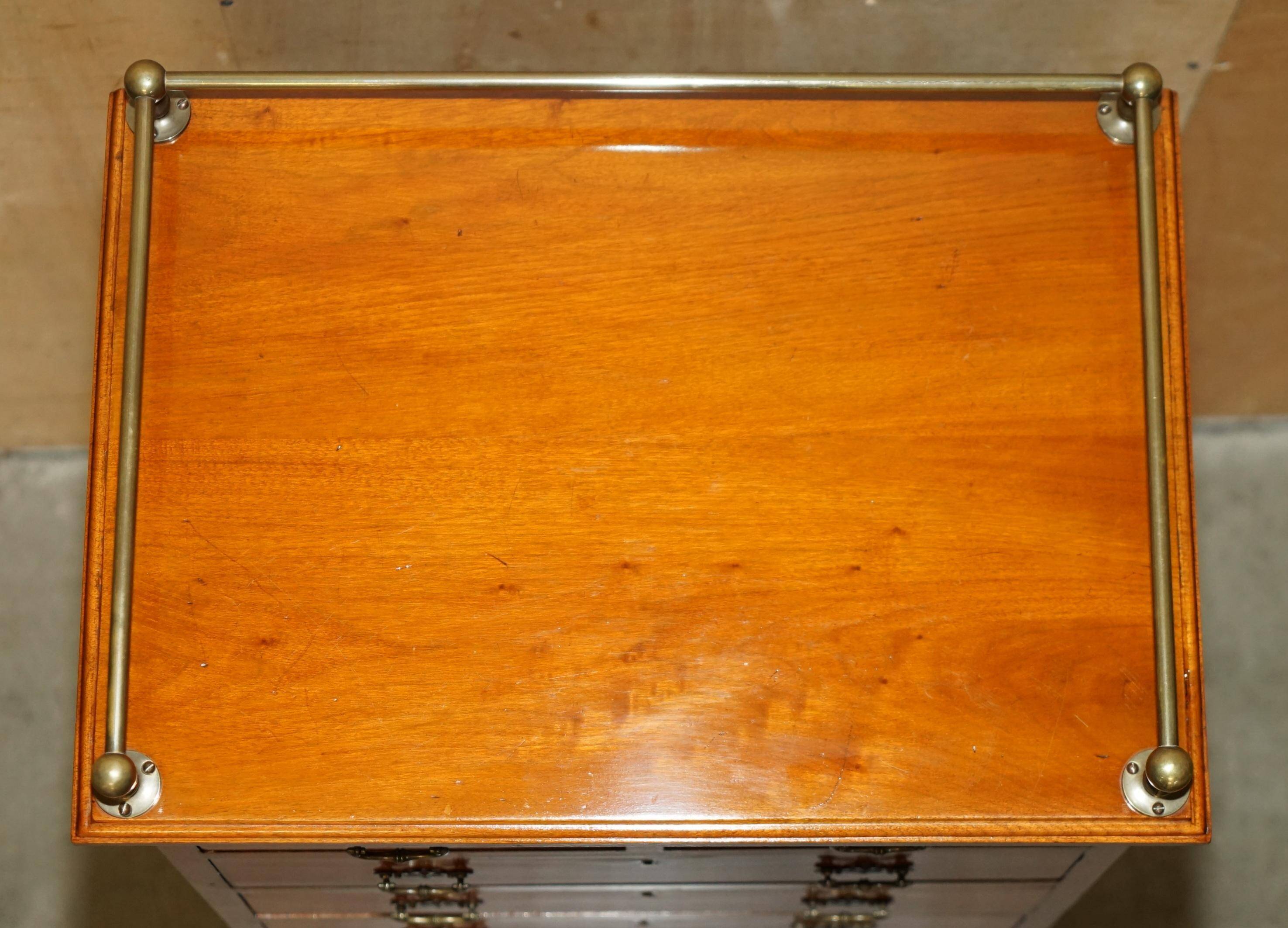 Victorian high chest of drawers in walnut with a bronze gallery.