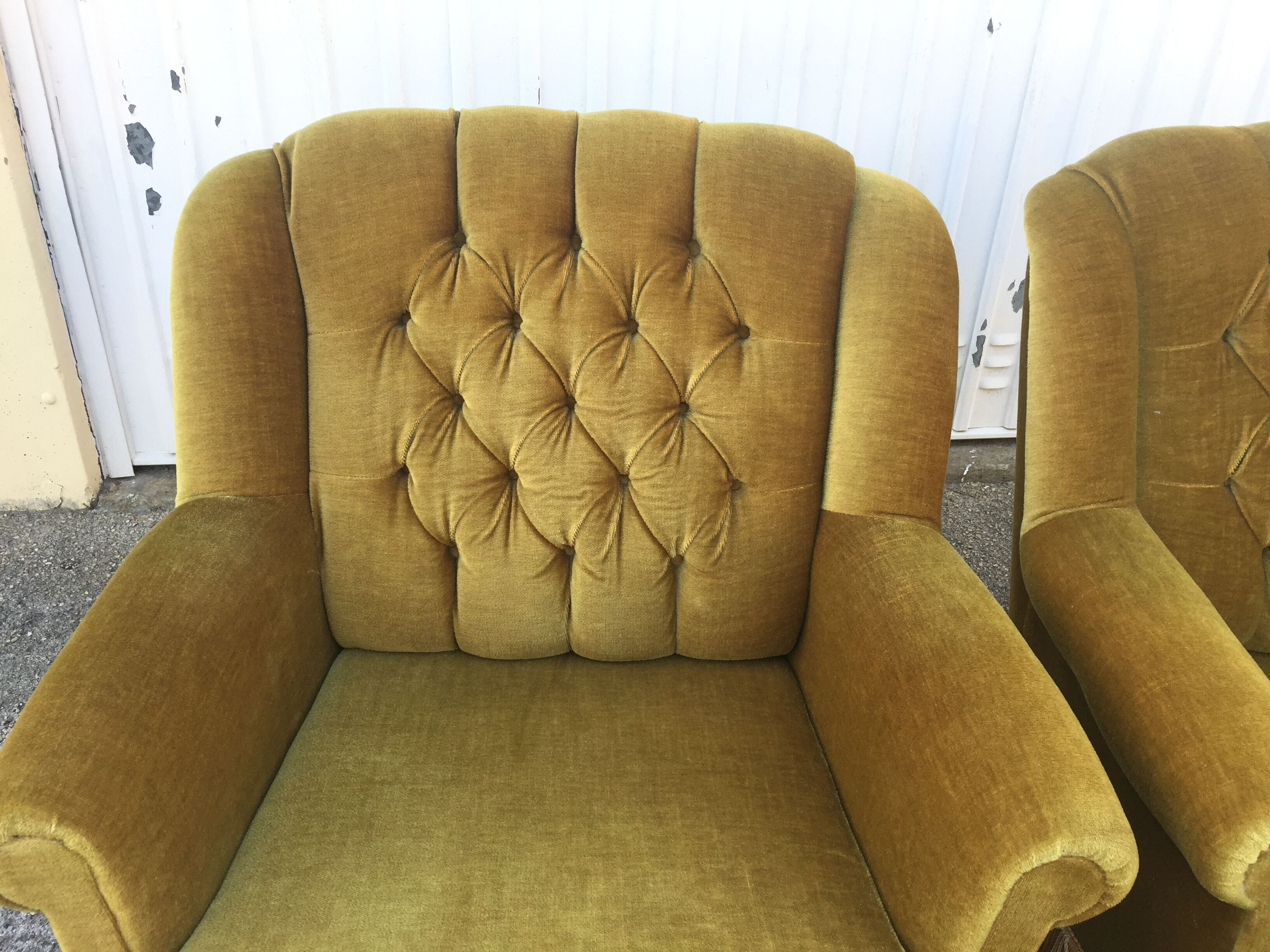 Pair of upholstered velvet armchairs