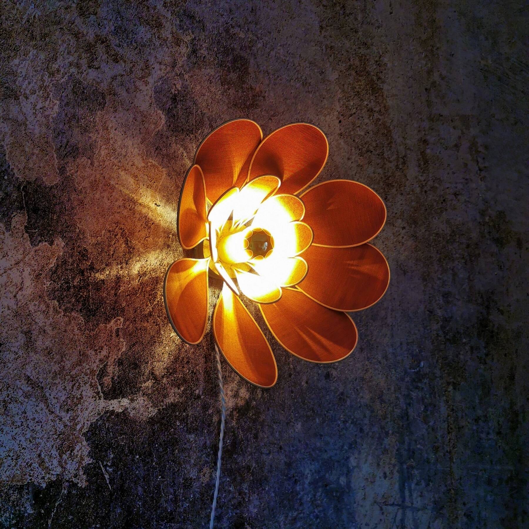 Flower wall light made of rattan and terracotta linen petals