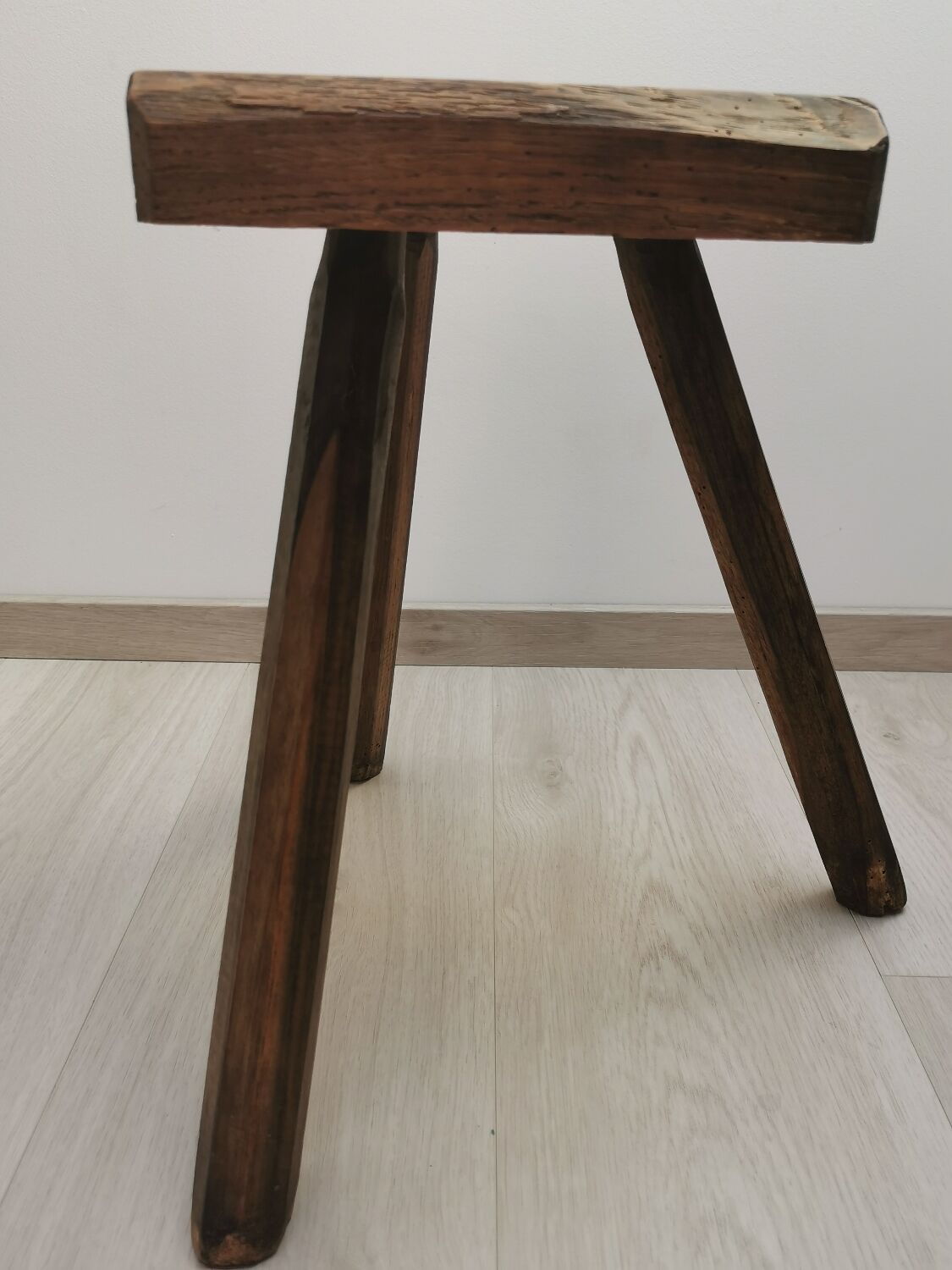 Old wooden stool tripods