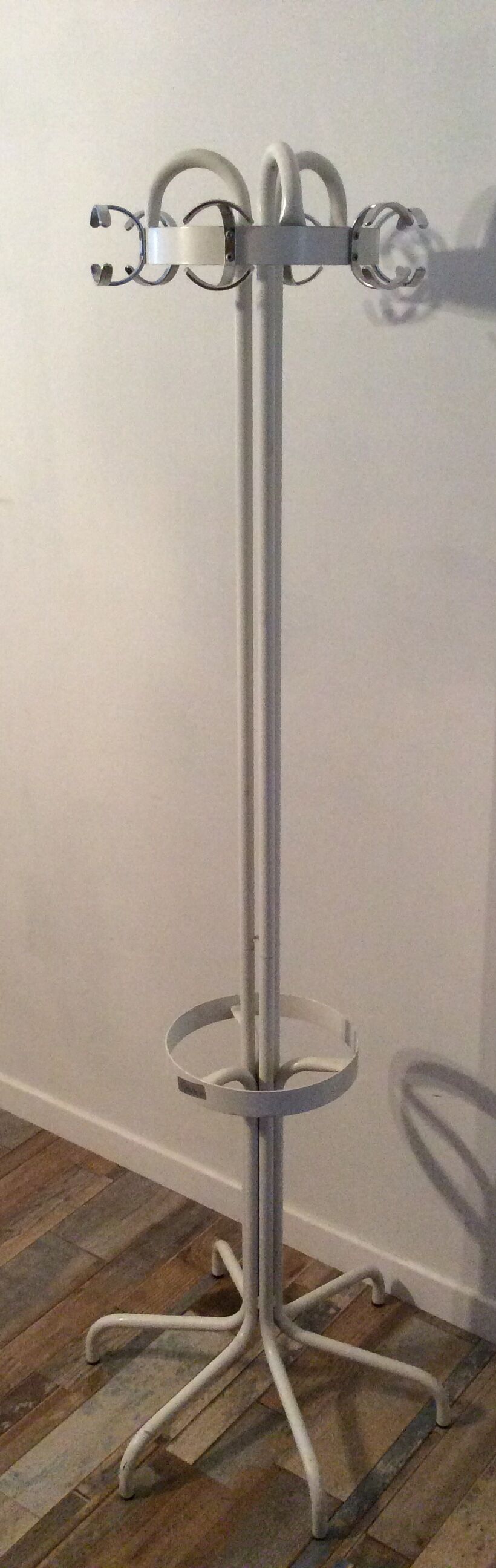 Vintage metal coat rack on foot