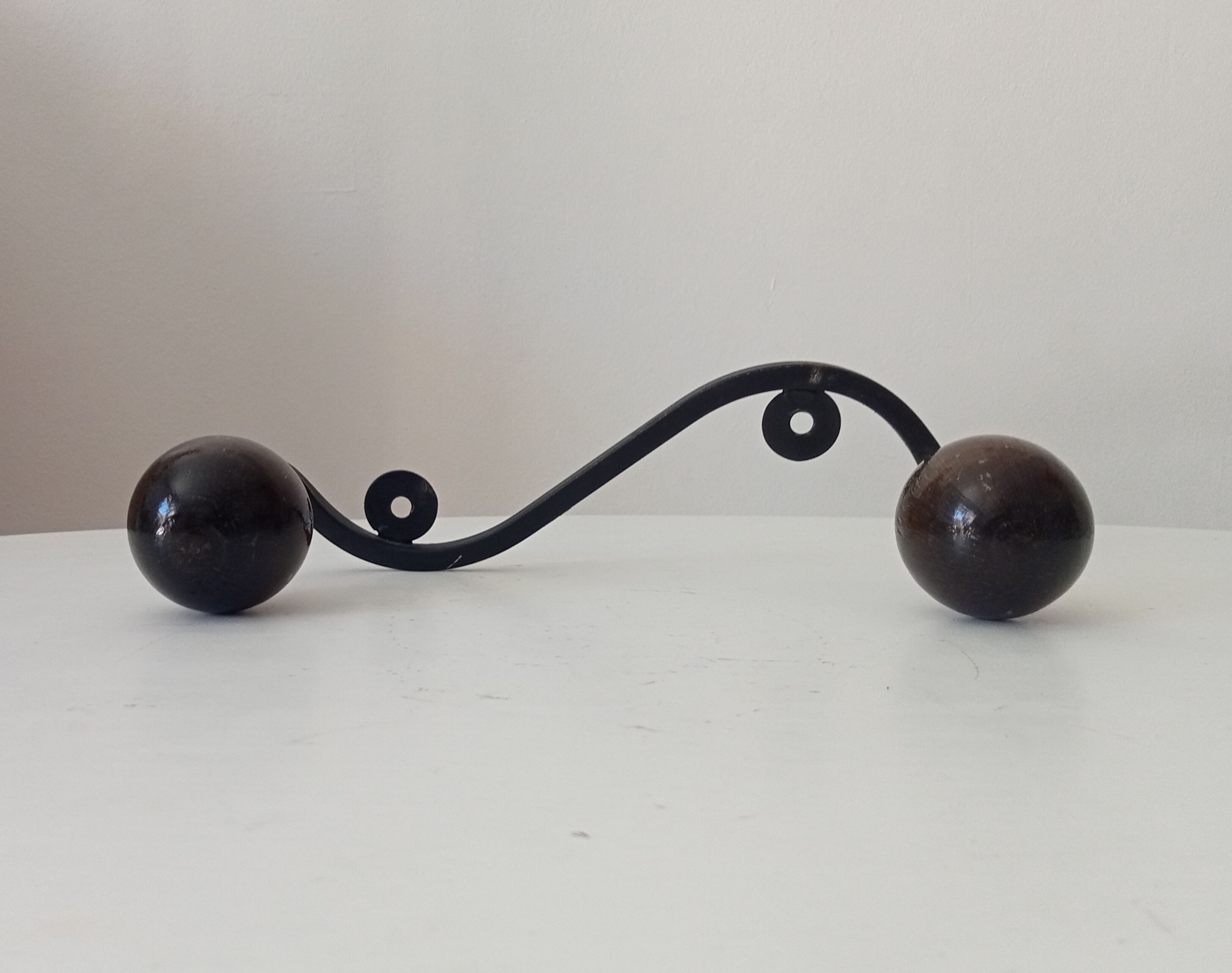 Wood and wrought iron ball coat rack from the 1950s.