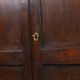 Charming and timeless antique English oak cabinet/commode from the early 19th century with two doors and a working lock